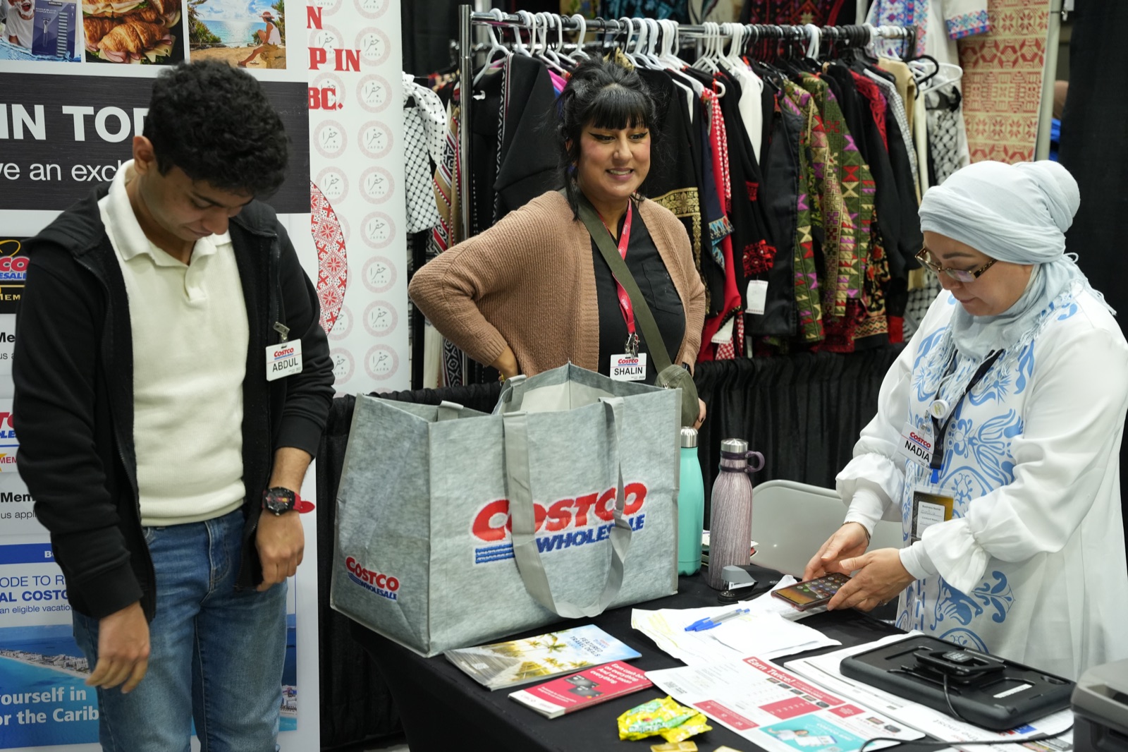 Smiling vendors at a booth