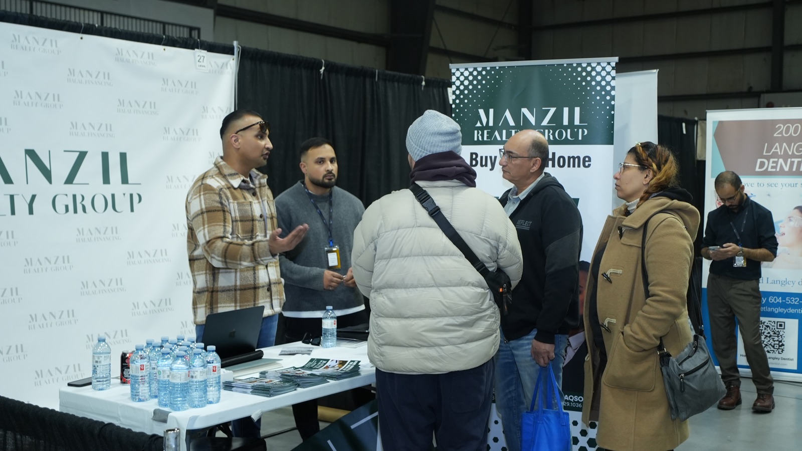 Visitors gathered at a busy booth